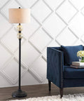 60 Inch Oil Rubbed Bronze Mercury Glass LED Floor Lamp With Grey Linen Drum Shade Classic Tall Standing Lamp For Living Room Foot Switch LED Bulb Included ETL Listed next to blue sofa.