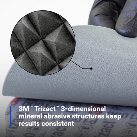 Close-up of Trizact Hookit 3 Inch P1000 Grit Blending Disc Gray For Auto Body Sanding showing 3D abrasive structure and foam backing.