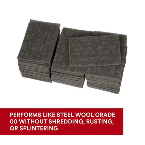 Stack of Ultra Fine Grade Hand Pad For Surface Prep And Finishing, Nonwoven Silicon Carbide, 6x9 in, Case of 60, gray color.