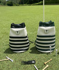 Two Premium Leather Golf Valuables Pouches with Drawstrings on grass, black and green large bucket style with accessories