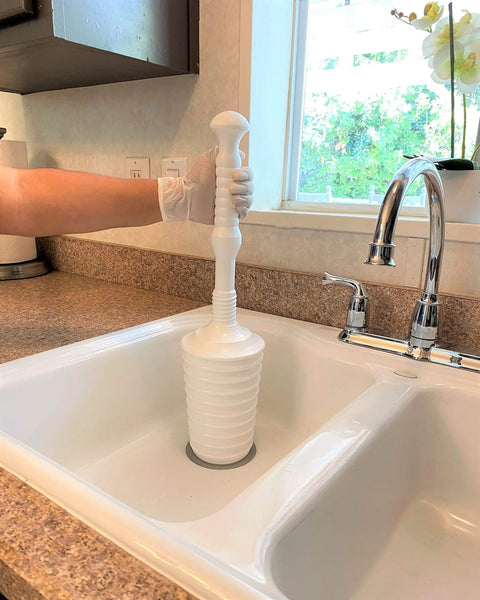 Heavy Duty Toilet Plunger Kit With Smart Air Relief Valve And Spacious Tall Bucket Caddy in use above kitchen sink.