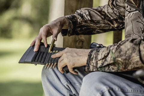 Man loading Butt Stock Rifle Shell Holder For Grab And Go Quick Access Pouch, Fits Snugly Around Rifle Butt, Holds 9 Cartridges