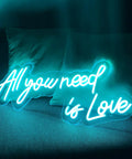 All You Need Is Love Neon Sign LED Light For Home Bar Party Decor glowing on sofa, Customizable Neon Wall Art, 60x26cm