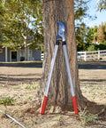 Super Duty 32 Inch Bypass Lopper With MAXFORGED Steel leaning against a tree in a sunny garden