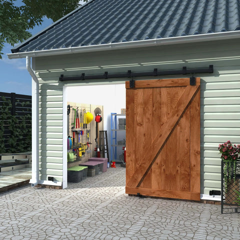 Heavy Duty Exterior Sliding Barn Door Track Kit With Five Brackets 9 Foot Black Weatherproof Wall Mount Hardware For Large Doors And Gates Supports Up To 500 Lbs Smooth Operation And Durable Rail System installed on a garage with a wooden door.