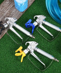 Heavy Duty Airless Paint Spray Gun 3 Pack With 513 515 519 Tips on grass, featuring stainless steel construction and ergonomic grips.