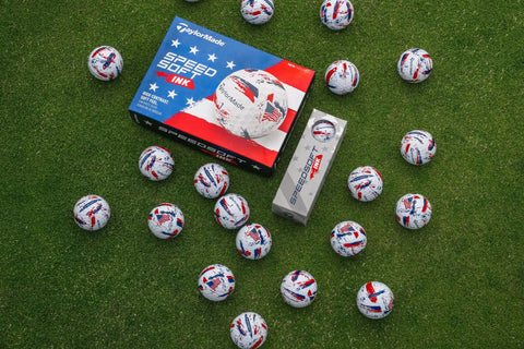 SpeedSoft Ink USA Dozen Soft Golf Balls With Ultra Low Compression PWRCORE Technology arranged on grass with packaging