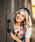 Beefy Heavy Duty Barn Door Handles Set Of 2 Black Rustic Cast Iron Gate Handles For Farmhouse Decor Sliding Doors With Hardware Large 9 Inch Indoor And Outdoor Use Pre Drilled Holes installed on a wooden door with a woman holding flowers.