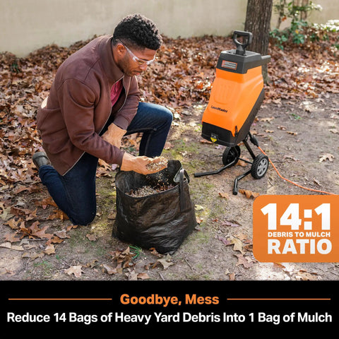 Man using FD1503 Electric Wood Chipper Shredder 15 Amp Motor With 1.8 Inch Cutting Diameter And 14 To 1 Reduction for mulching