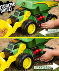 Child playing with Motorized Dig Rig 2 In 1 Toy Dump Truck And Front Loader with joystick controls and realistic features