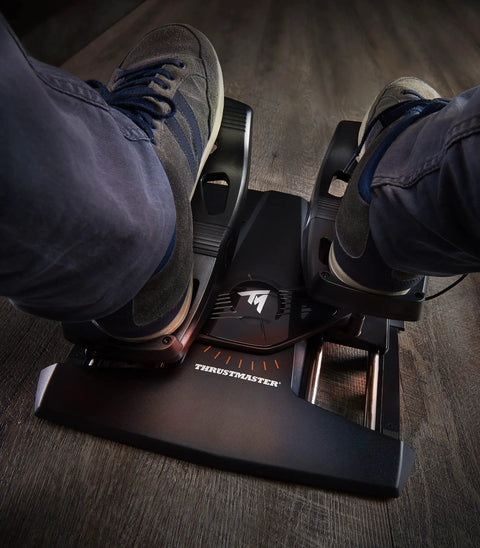 Close-up of feet on Precision Flight Sim Rudder Pedals for PS5, Xbox, and PC With Long Travel Axis on wooden floor.