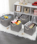 Hella Roomy Gray Fabric Cube Storage Boxes With Quick Fold Down Design For Closets And Shelving Units filled with toys and books.