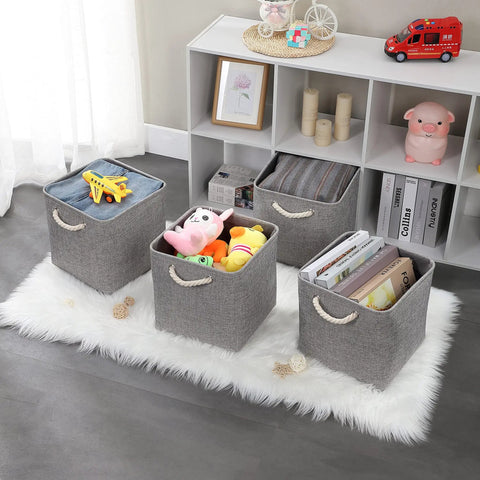 Hella Roomy Gray Fabric Cube Storage Boxes With Quick Fold Down Design For Closets And Shelving Units filled with toys and books.