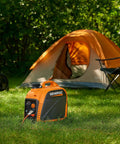 GP2500i 2,500-Watt Gas Powered Portable Inverter Generator With Parallel Capability, Tiny But Mighty Build, beside an orange tent