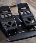 Precision Flight Sim Rudder Pedals for PS5, Xbox, and PC with long travel axis on hardwood floor