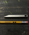 Beefy Heavy Duty Keychain Pry Bar For Everyday Carry, Stainless Steel Minimalist EDC Multitool next to a pencil on a dark surface.