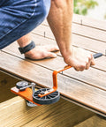 Image of Heavy Duty Deck Board Straightener And Bow Clip Lever Tool being used to align warped lumber on a deck.