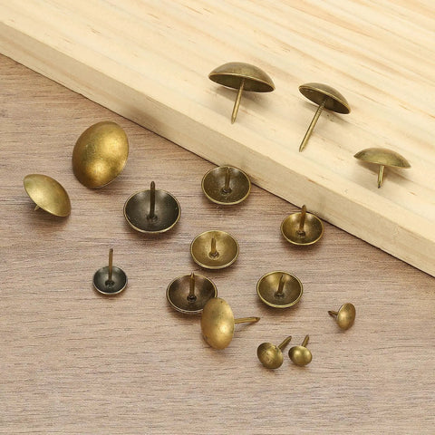 Total Breeze 100 Pcs Top Shelf Upholstery Tacks With 3/8 Inch Round Head And 0.35 Inch Length smooth metal push pins on wood.