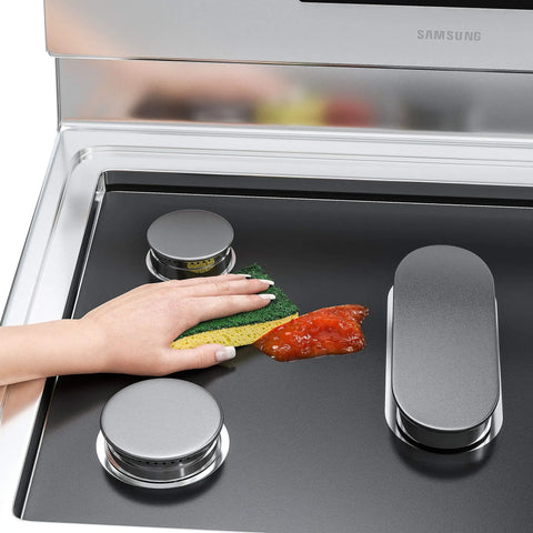 Cleaning Reusable Gas Range Protectors For 5 Burner Stove With Nonstick Surface on Samsung gas burner with sponge and sauce.
