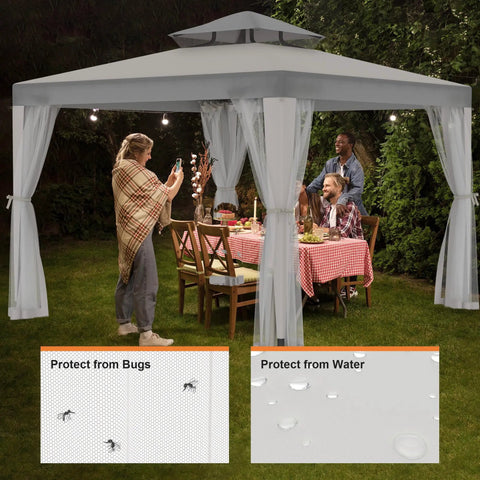 Family dining under a Patio Gazebo Tent 10x10 Outdoor Canopy Shelter With Removable Netting, 100 Sq Ft Of Shade For Garden, Backyard, Deck Or Lawn, Portable Gray Weather Resistant Shelter