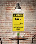 High Visibility Pro Grade 8 By 12 Aluminum Warning Sign displayed on brick wall above table