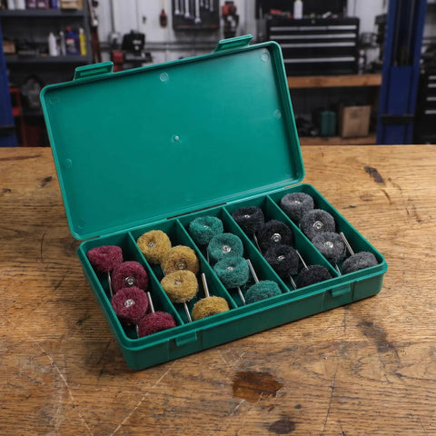 1 Inch Mini Polishing Wheels Set 100 Pcs Abrasive Buffing Wheels in green case on workshop table