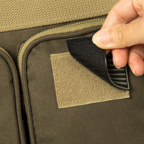 Close-up of US flag patch being applied on Heavy Duty Tactical Range Duffel With MOLLE Gear, Lockable Zippers, Khaki 27 Inch