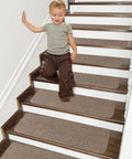 Child walking on wooden steps with Non Slip Stair Treads Carpet Mats 28 By 9 Inches Indoor Stair Runners For Wooden Steps Teal 10 Pack