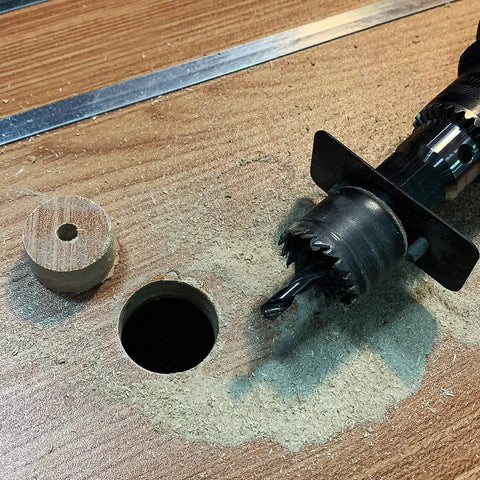 Heavy Duty Wood Hole Saw Kit, 16 Piece Set, cutting hole in wood with mandrel attached, circular cutout beside it, for PVC etc.