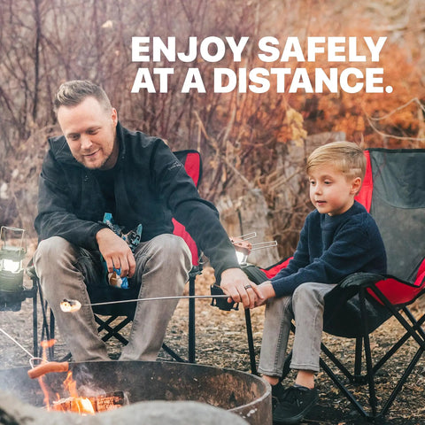 Father and son using Long 32 Inch Smores Sticks Kit With Stainless Steel Skewers And Smooth Wooden Handles For Marshmallow Roasting At The Campfire, Fire Pit Gear For Outdoor Camping, 5 Pack, Durable Essentials
