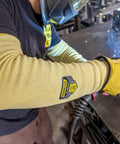 Heavy Duty Eighteen Inch Kevlar Arm Sleeves Featuring Legit A3 Cut Resistant Armor and Heat Proof Double Layer Weave in use during welding.
