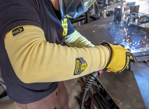 Heavy Duty Eighteen Inch Kevlar Arm Sleeves Featuring Legit A3 Cut Resistant Armor and Heat Proof Double Layer Weave in use during welding.