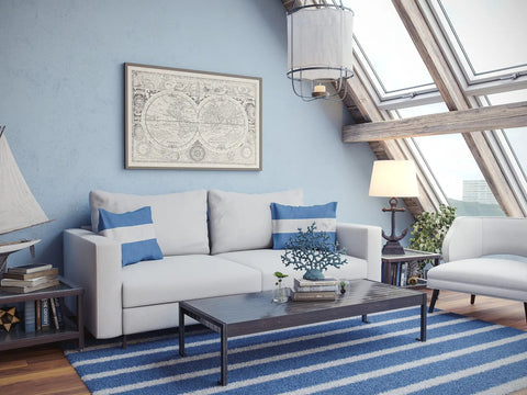 Living room with nautical decor, white sofa, striped rug, and Aweigh Table Lamp With Weathered Bronze Finish For Coastal Casual Living Rooms.