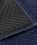 Close-up of Pro Economy Moving Blanket 80 By 72 Inches Premium Quilted Shipping Furniture Pad Navy Blue And Black Heavy Duty Cushioning.