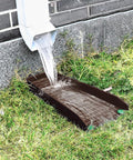 Heavy Duty Gutter Downspout Splash Blocks To Keep Your Backyard Dry And Foundation Safe 16 Inch Brown draining rainwater from downspout