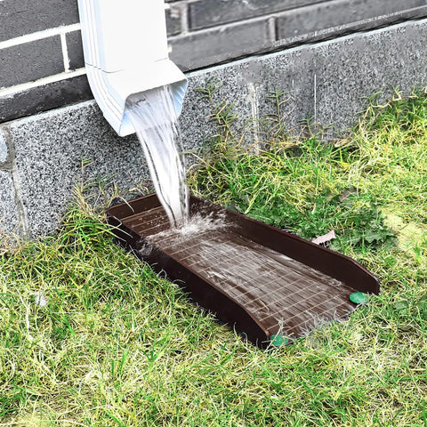 Heavy Duty Gutter Downspout Splash Blocks To Keep Your Backyard Dry And Foundation Safe 16 Inch Brown draining rainwater from downspout