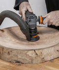 Heavy Duty Power Carving Tool Attachment Featuring A Slick Two Inch Cutting Disc And Adjustable Sanding System used on raw timber.