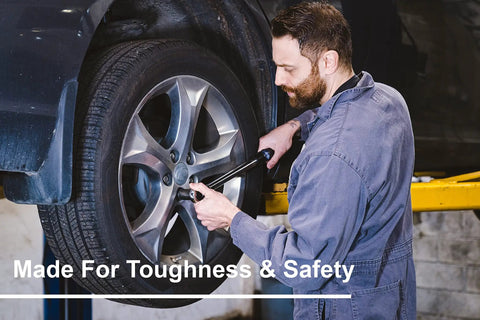 Mechanic using 3/8 Inch Drive Dual Direction Click Torque Wrench, 10-80 Ft-Lb, on car wheel for precise torque control.