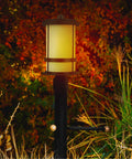 Wilburn 1 Light Outdoor Post Lantern in Black for Patio and Garden Decor with warm glow in garden setting, weatherproof post lamp.
