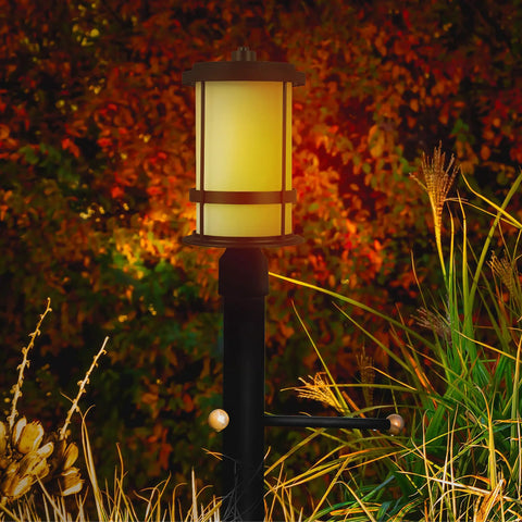 Wilburn 1 Light Outdoor Post Lantern in Black for Patio and Garden Decor with warm glow in garden setting, weatherproof post lamp.
