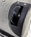 Wheel detail of Newcastle 15 Inch Underseat Luggage With Telescoping Handle And Black White Herringbone Rolling Tote And Overnight Bag