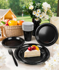 Fresh Black Disposable Plates 350 Piece Heavy Duty Food Grade Plastic Party Essentials For Weekend Ragers And Halloween Parties with cake and cutlery.