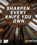 Roam Ready Guided Field Sharpener With Diamond Guides And Adjustable Wrench Gives You Hella Versatile Home Shop Or Campout Blade Care That Is Truly Top Shelf And Keeps Every Pocketknife Sharp As A Tack On The Trail with various knives on a wooden table.