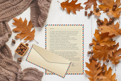 Vintage Airmail Stationery Set With Envelopes, 100-Piece Letter Size 8.5x11, lined paper and envelope surrounded by autumn leaves