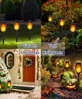 Lit Outdoor Solar Torch Lights Flickering Flame Set Of 12 LED Solar Garden Lights illuminating pathways and garden areas