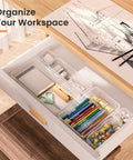 Clear Drawer Organizers Set Five Sizes Straight Up Tames Messy Vanities, organizing pens and stationery in a workspace drawer.