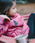 Child wearing a jacket with Tenacious Tape Repair Patches Peel And Stick Nylon Gear Patches for jackets, no sewing required.