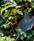 Beast Of A Compact Steel Garden Spade With Serrated Blade And Inverted V Tip For Root Removal, red spade cutting plant roots.