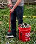 Person using Magnetic Pickup Tool With 25lb Pull 27.5 Inch Reach Quick Release Handle to collect metal scraps outdoors