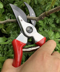 8 Inch Bypass Pruning Shears cutting branch in garden with drop forged steel, ergonomic non-slip red handles for bonsai trimming